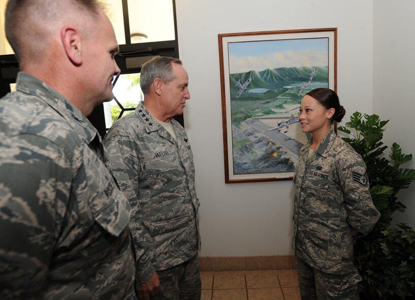 Air Force Chief of Staff Gen. Mark A. Welsh III meets Staff Sgt. Rachael Ng during a visit to Joint Base Pearl Harbor-Hickam, Aug. 19, 2013.  This was the first stop of a multi-day tour to the Pacific, Welsh's first visit to the region as Air Force chief of staff. Welsh and Chief Master Sgt. of the Air Force James A. Cody were accompanied by their spouses, Betty and Athena; together they met with Airmen and their families to thank them for the service and dedication, and to discuss challenges and opportunities in the Pacific theater. (U.S. Air Force photo/Tech. Sgt. Jerome S. Tayborn)
