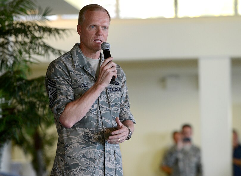 Chief Master Sgt. of the Air Force James A. Cody, speaks at an Airman's call during his visit to Joint Base Pearl Harbor-Hickam, Aug. 19, 2013.  Cody and his wife, Athena, accompanied Air Force Chief of Staff Gen. Mark A. Welsh III and his wife, Betty. Together they met with Airmen and their families to thank them for the service and dedication, and to discuss challenges and opportunities in the Pacific theater. (U.S. Air Force photo/Scott M. Ash)