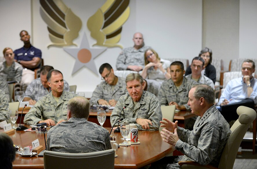 Air Force Chief of Staff Gen. Mark A. Welsh III has lunch with Airmen during his visit to Joint Base Pearl Harbor-Hickam, Aug. 19, 2013.  During the lunch, Welsh and Chief Master Sgt. of the Air Force James A. Cody answered questions ranging from sequestration impacts to force structure and benefits. This was the first stop of a multi-day tour to the Pacific, providing Welsh and  Cody, the opportunity to meet Airmen and their families, and thank them for the service and dedication. This is Welsh's first visit to the region as Air Force chief of staff.   (U.S. Air Force photo/Scott M. Ash)