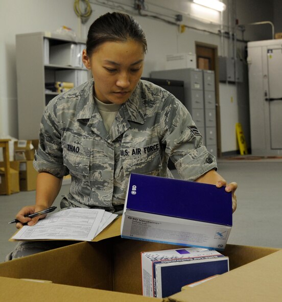 Senior Airman Evalin Zhao, 2nd Medical Support Squadron medical logistics technician, inventories medical supplies on Barksdale Air Force Base, La., Aug. 21, 2013. Medical logistics Airmen must keep records of incoming and outgoing equipment at the medical logistics warehouse. (U.S. Air Force photo/Airman 1st Class Andrew Moua)
