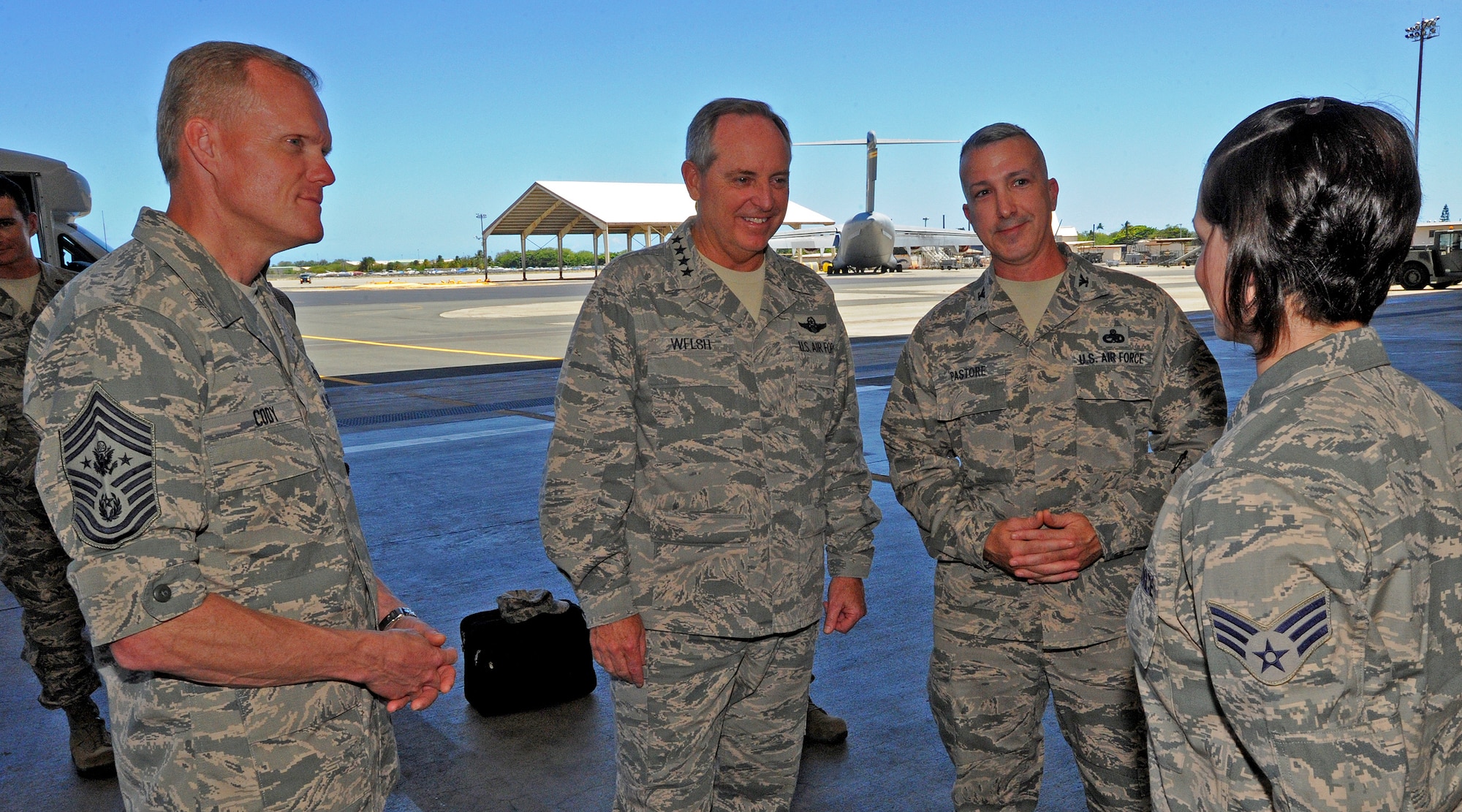 Chief Master Sgt. of the Air Force James Cody, Air Force Chief of Staff Gen. Mark A. Welsh III and Col. David Pastore, 15th Maintenance Group commander,  talk to Airmen from the 15th MXG at Hangar 35 at Joint Base Pearl Harbor-Hickam, Hawaii, during a visit Aug. 19, 2013. Welsh and Cody arrived at JBPH-H on their first leg of a tour to various locations within the Pacific area of responsibility. (U.S. Air Force photo/Tech. Sgt. Jerome S. Tayborn)