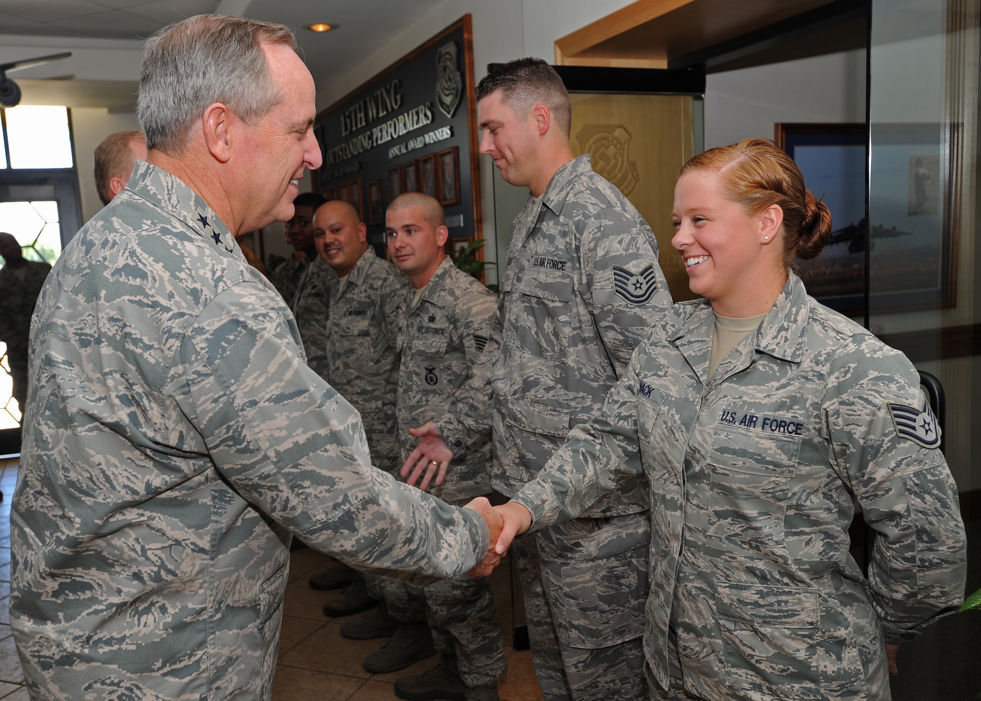 Air Force Chief of Staff Gen. Mark A. Welsh III shakes hands with 15th Wing and 647th Air Base Group Airmen at Joint Base Pearl Harbor-Hickam, Hawaii, during a visit to the base Aug. 19, 2013. As part of a three-day visit to Hawaii, Welsh and Chief Master Sgt. of the Air Force James Cody thanked Airmen for their continued service and dedication and addressed issues concerning Airmen and their families. (U.S. Air Force photo/Tech. Sgt. Jerome S. Tayborn)