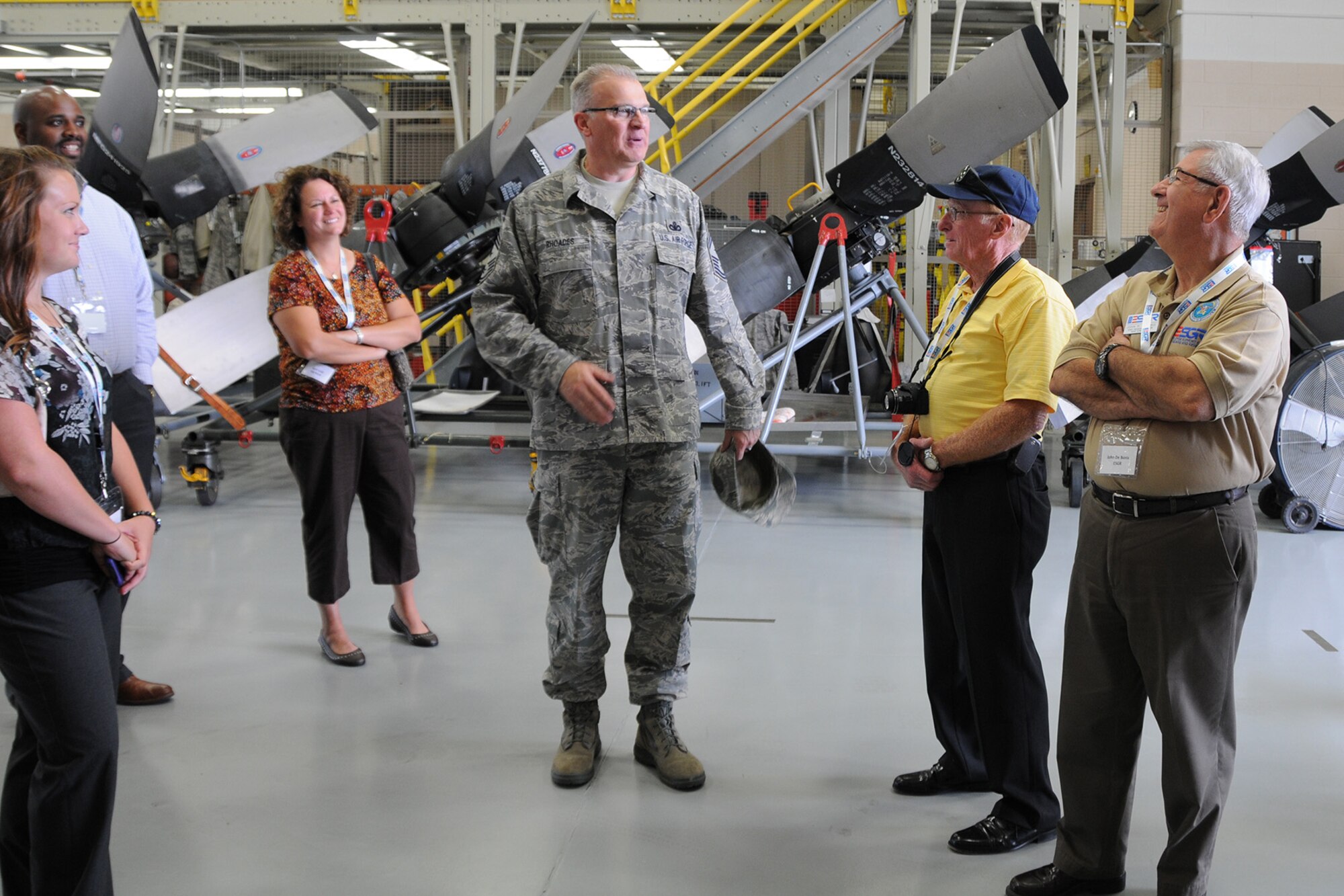 YOUNGSTOWN AIR RESERVE STATION, Ohio – Air Force Reserve 910th Airlift Wing Command Chief Master Sgt. Troy Rhoades talks with a group of employers and representatives of Ohio Employer Support of the Guard and Reserve (ESGR) in the propulsion maintenance shop here, August 2, 2013. The group of employers attended the inaugural Joint Employer Awareness Event, co-hosted by the 910th, the Ohio National Guard and Ohio ESGR. The two-day event gave employers of Air Force Reservists and Guardsmen the opportunity to get an up-close look at both Camp Ravenna and YARS. The event also gave the employers a better understanding of the mission that their employees carry out as members of the U.S. Armed Forces. U.S. Air Force photo by Senior Airman Rachel Kocin