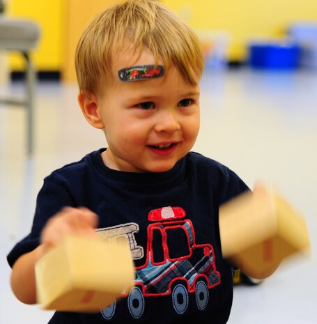One year old Maxwell Shaw, son of Tech. Sgt. Michael Shaw, 437th Aerial Port Squadron cargo processing supervisor, plays at the Joint Base Charleston medical group's Teddy's Child Watch center while his mom went to a medical appointment, Aug. 20, 2013 at JB Charleston- Air Base, S.C. Teddy's Child Watch provides short-term staff supervision to well children ages six weeks through 11 years old. The purpose of Teddy's is to help alleviate the stress of parents and guardians trying to find child care during medical appointments. You can assure that their child's health, safety and well-being are protected. (U.S. Air Force photo/ Airman 1st Class Chacarra Neal)