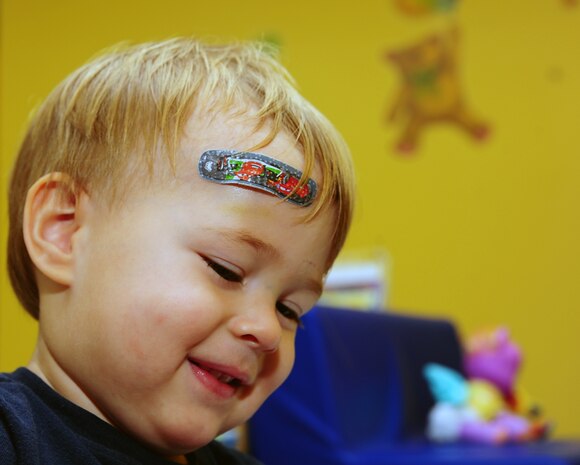 One year old Maxwell Shaw, son of Tech. Sgt. Michael Shaw, 437th Aerial Port Squadron cargo processing supervisor, plays at the Joint Base Charleston medical group's Teddy's Child Watch center while his mom went to a medical appointment, Aug. 20, 2013 at JB Charleston- Air Base, S.C. Teddy's Child Watch provides short-term staff supervision to well children ages six weeks through 11 years old. The purpose of Teddy's is to help alleviate the stress of parents and guardians trying to find child care during medical appointments. You can assure that their child's health, safety and well-being are protected. (U.S. Air Force photo/ Airman 1st Class Chacarra Neal)