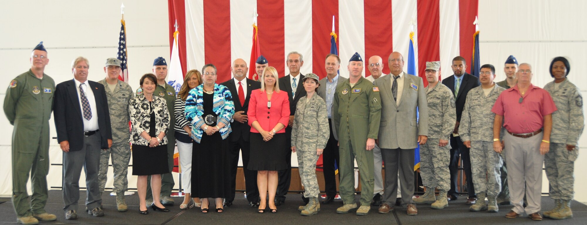 514th Air Mobility Wing honorary commanders and base commanders muster to commemorate their inductions to the Honorary Commanders program held here Aug. 20. New local community leaders will serve as advocates for the programs, missions and policies of the 514th AMW and are invited to participate in various installation and unit events (U.S. Air Force photo/Senior Airman Chelsea Smith).