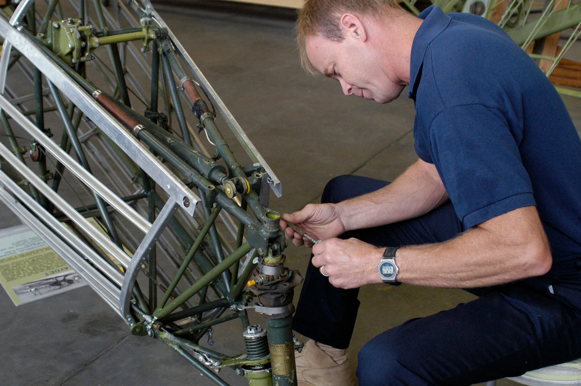 DAYTON, Ohio (08/2013) -- National Museum of the U.S. Air Force restoration specialist Brian Lindamood works on the Stearman PT-13D Kaydet. (U.S. Air Force photo)