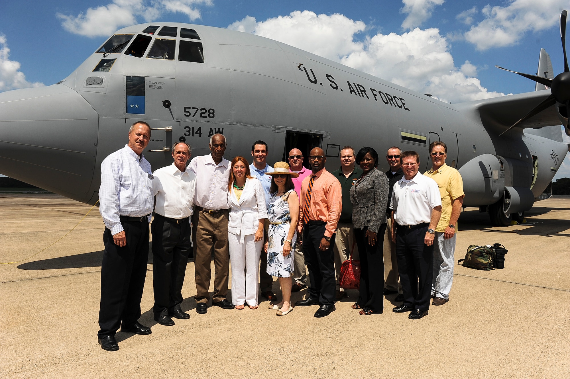 Community members and elected officials stand next to Team Little Rock’s newest C-130J Aug. 20, 2013, at Little Rock Air Force Base, Ark. The Rock is the largest C-130 base in the world and is home to the Center of Excellence, the premiere C-130 training school with students from all over the globe. (U.S. Air Force photo by Airman 1st Class Cliffton Dolezal)