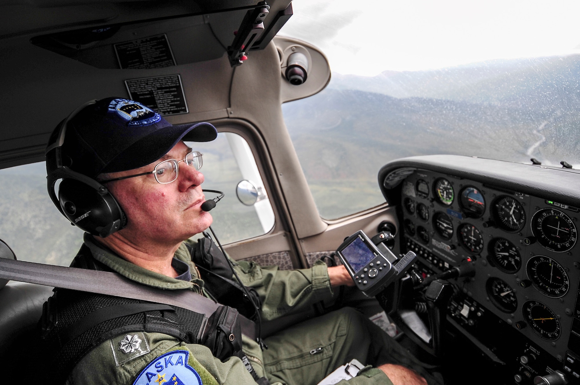 Mark Biron, Civil Air Patrol 71st Composite Squadron member, pilots a CAP Cessna 172 over the Joint Pacific Alaska Range Complex during RED FLAG-Alaska 13-3 Aug. 19, 2013. The 71st CS participated during RF-A, simulating low-flying threats for participating blue forces. (U.S. Air Force photo by Senior Airman Zachary Perras/Released)