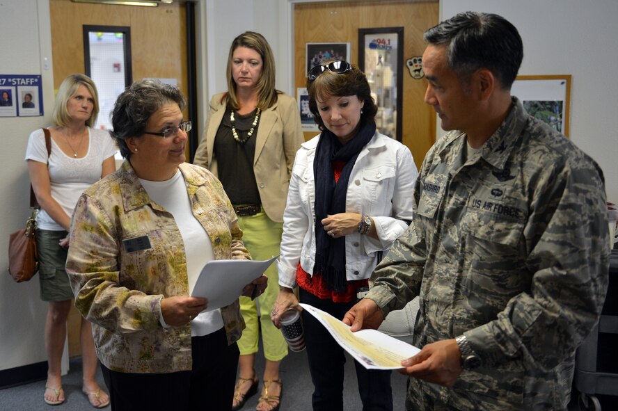 Col. David Kumashiro, 62nd Airlift Wing commander, along with spouses of Team McChord’s leadership, speak with Sophia “Bea” Curl, McChord Field Child, Youth and School services chief, during a tour of the Child Development Center, Aug. 20, 2013 at Joint Base Lewis-McChord, Wash. Kumashiro toured the CDC as part of his newcomer’s immersion after taking command of the 62nd Airlift Wing. (U.S. Air Force photo/Staff Sgt. Jason Truskowski)