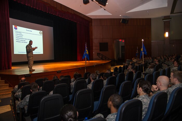 Col. Richard McComb, Joint Base Charleston commander, addresses the audience during his commander's call Aug. 16, 2013, at the Base Theater, on JB Charleston - Air Base, S.C. McComb held his last commander's call to speak on accomplishments made during his tenure, impending changes to be made, and challenges to face in the days to come. (U.S. Air Force photo/Tech. Sgt. Rasheen Douglas)