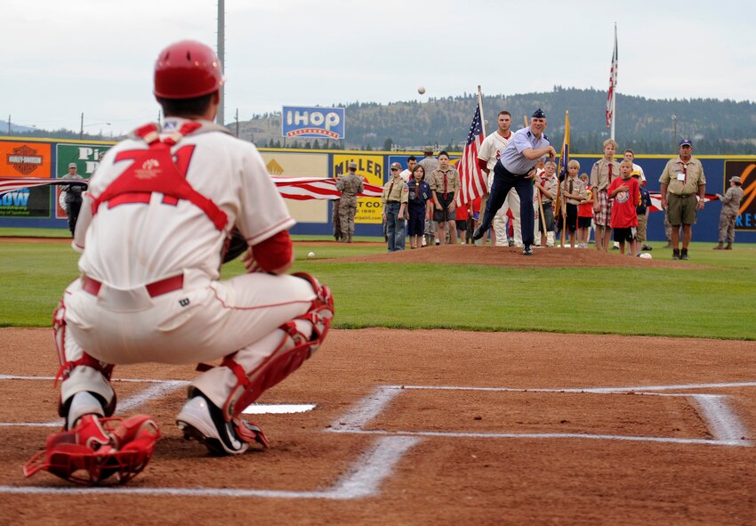 Col. Brian Newberry, 92nd Air Refueling Wing commander, throws the first pitch at the Spokane Indians game Avista Stadium in Spokane, Wash., Aug. 17, 2013. The Spokane Indians versed the Hillsboro Hops with a final score of 5 to 7. (U.S. Air Force photo by Airman 1st Class Ryan Zeski/Released)