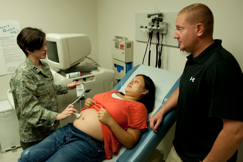 U.S. Air Force Capt. Carmen Baxter, 633rd Surgical Operations Squadron staff obstetrics gynecologist, finds a fetal heartbeat for expecting parents Maria Blalock and U.S. Army Sgt. 1st Class Robert Blalock, 733rd Mission Support Group from Fort Eustis, Va., at Langley Air Force Base, Va., Aug. 15, 2013.  The WHC is staffed with obstetrics and gynecologist physicians, certified nurse-midwives, nurse practitioners, residents, registered nurses, medical technicians, and administrative personnel ready to assist expecting parents at each appointment through the 40-week gestation period. (U.S. Air Force photo by Staff Sgt. Stephanie Rubi/Released)