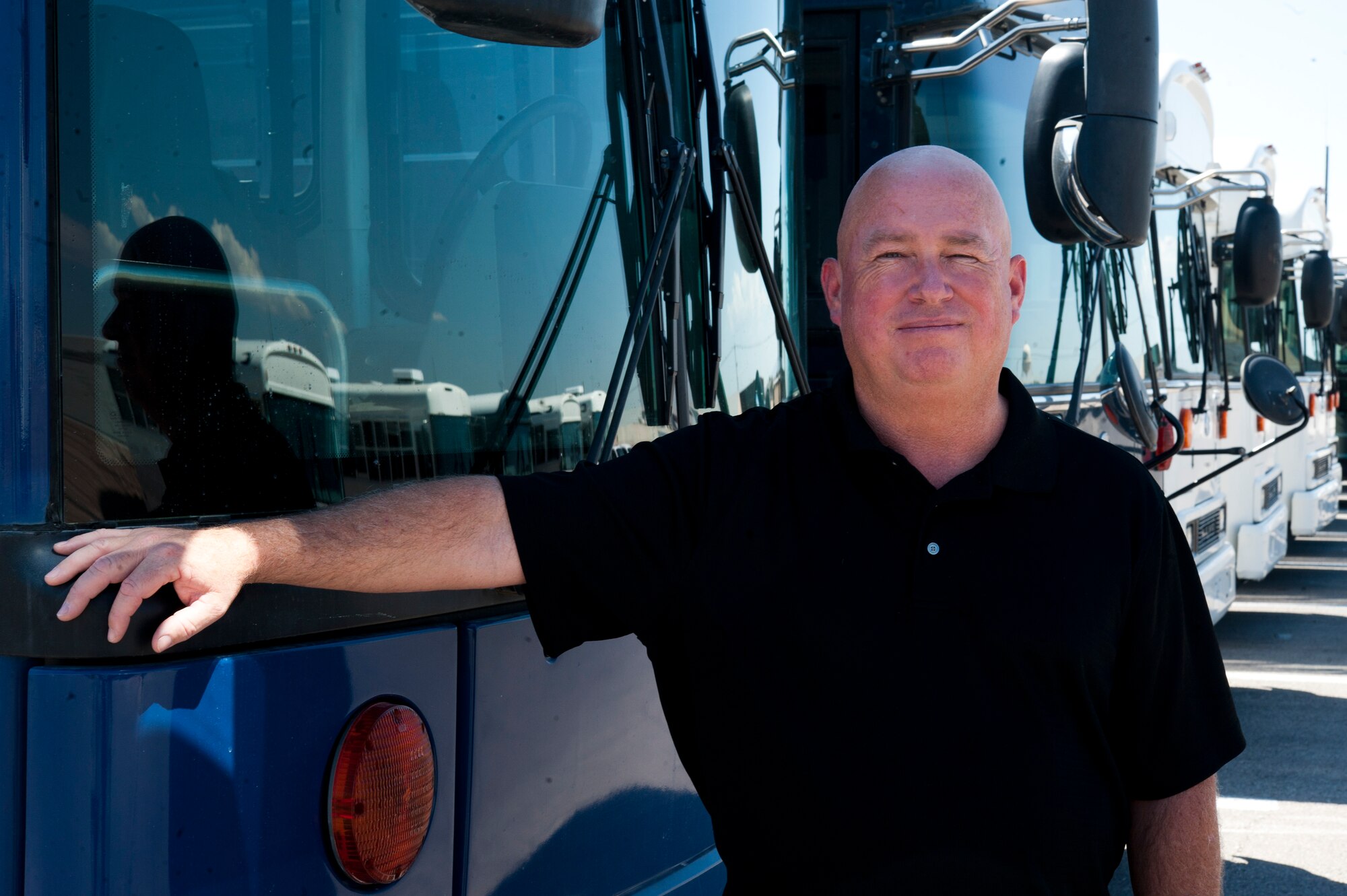 Kelly Keebler, 99th Logistics Readiness Squadron vehicle management and analysis supervisor, poses at the 99 LRS vehicle operations lot Aug. 16 at Nellis Air Force Base, Nev. Keebler was awarded the 2013 Bob Baker Fleet Manager of the Year Award in recognition of the new policies and procedures he’s implemented to make the organization and base-wide distribution of government vehicles more efficient. (U.S. Air Force photo by Airman 1st Class Joshua Kleinholz)