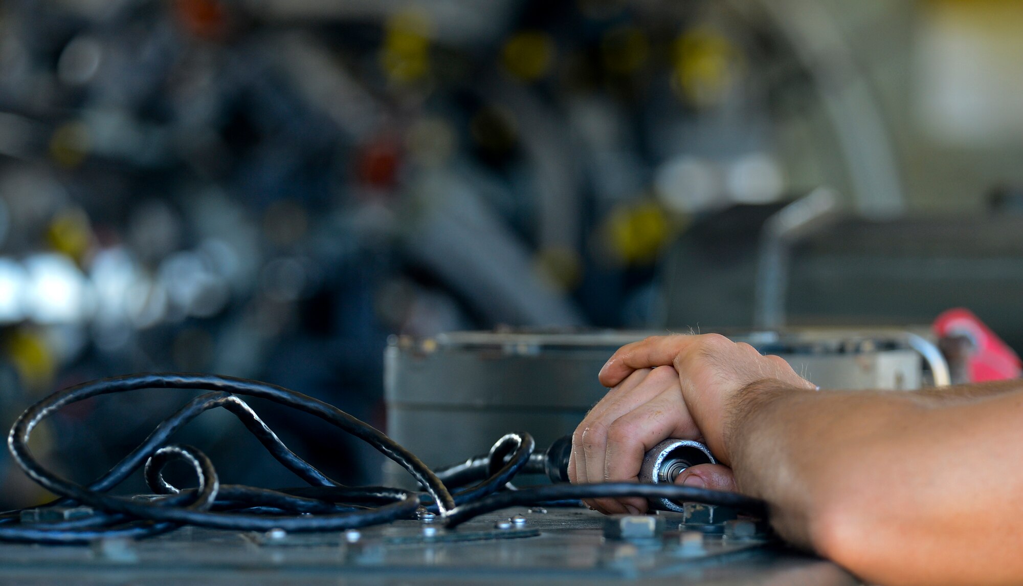 Senior Airmen Matthew Fernandez, 2nd Maintenance Group weapons standardization crew member, keeps his hand on the stop switch on Barksdale Air Force Base, La., Aug. 20, 2013. Each person on the crew has a stop switch to prevent the strategic rotary launcher from damaging government property or injuring an Airman. (U.S. Air Force photo/Senior Airman Micaiah Anthony)
