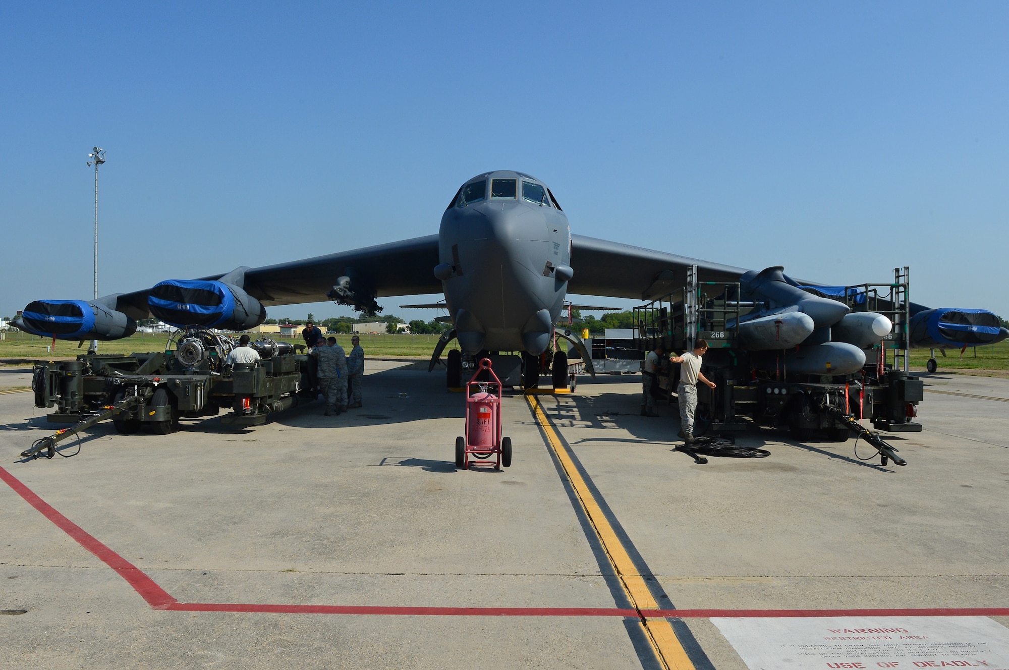 Airmen from the 2nd Maintenance Group weapons standardization prepare to load a strategic rotary launcher and an air launch cruise missile pylon to a B-52H Stratofortress on Barksdale Air Force Base, La., Aug. 20, 2013. The B-52 is capable of carrying 70,000 pounds of mixed ordnance and is capable of flying 7,652 nautical miles or 8,800 miles without being refueled by another aircraft. (U.S. Air Force photo/Senior Airman Micaiah Anthony)
