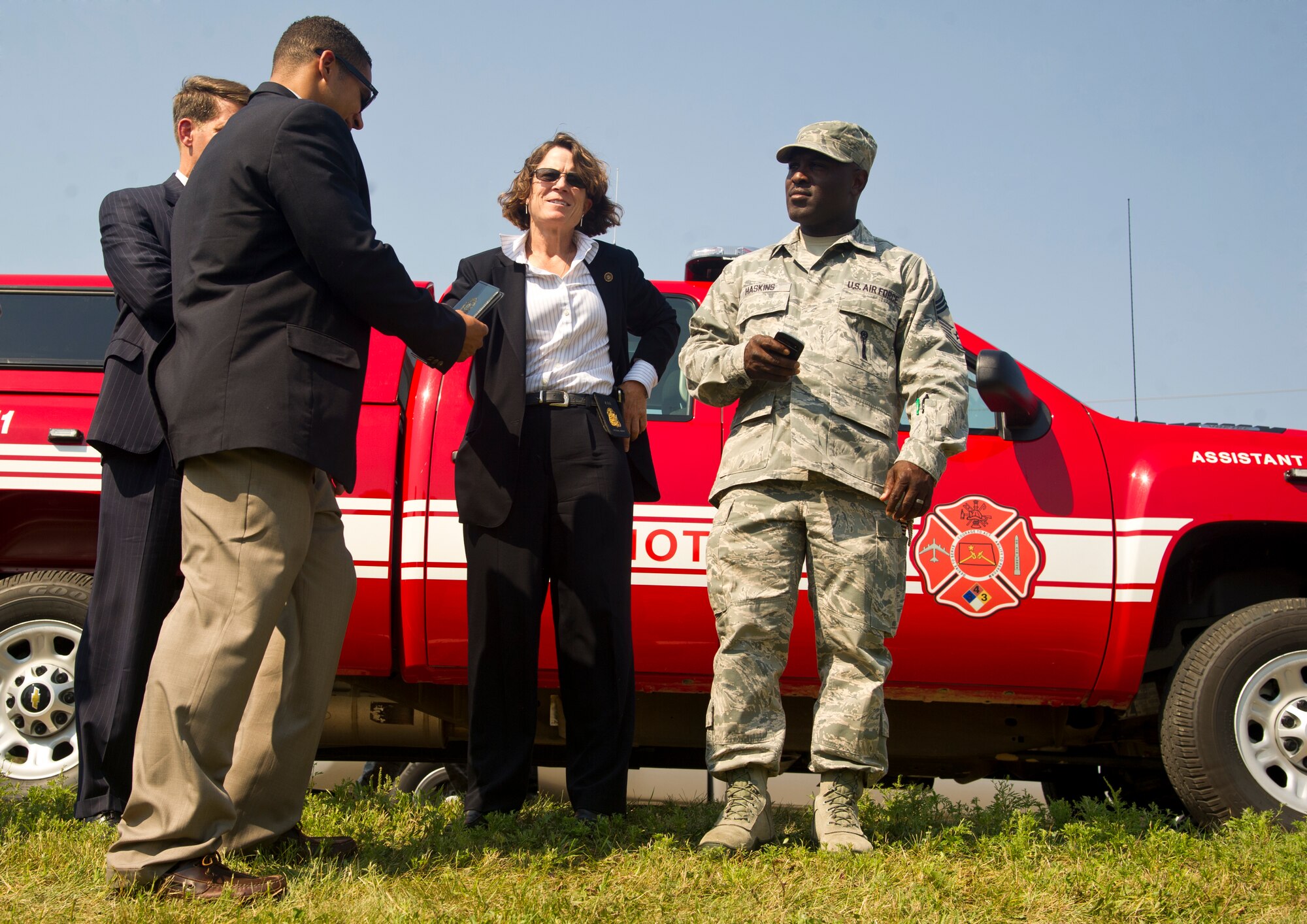 Agents from the Federal Bureau of Investigations arrive at the scene of an incident during a field training exercise at Minot Air Force Base, N.D., Aug. 20, 2013. The purpose of the exercise was to evaluate and validate the integration and response of emergency management, security forces, fire department, medical and missile field operations during a natural disaster. (U.S. Air Force photo/Senior Airman Brittany Y. Auld)