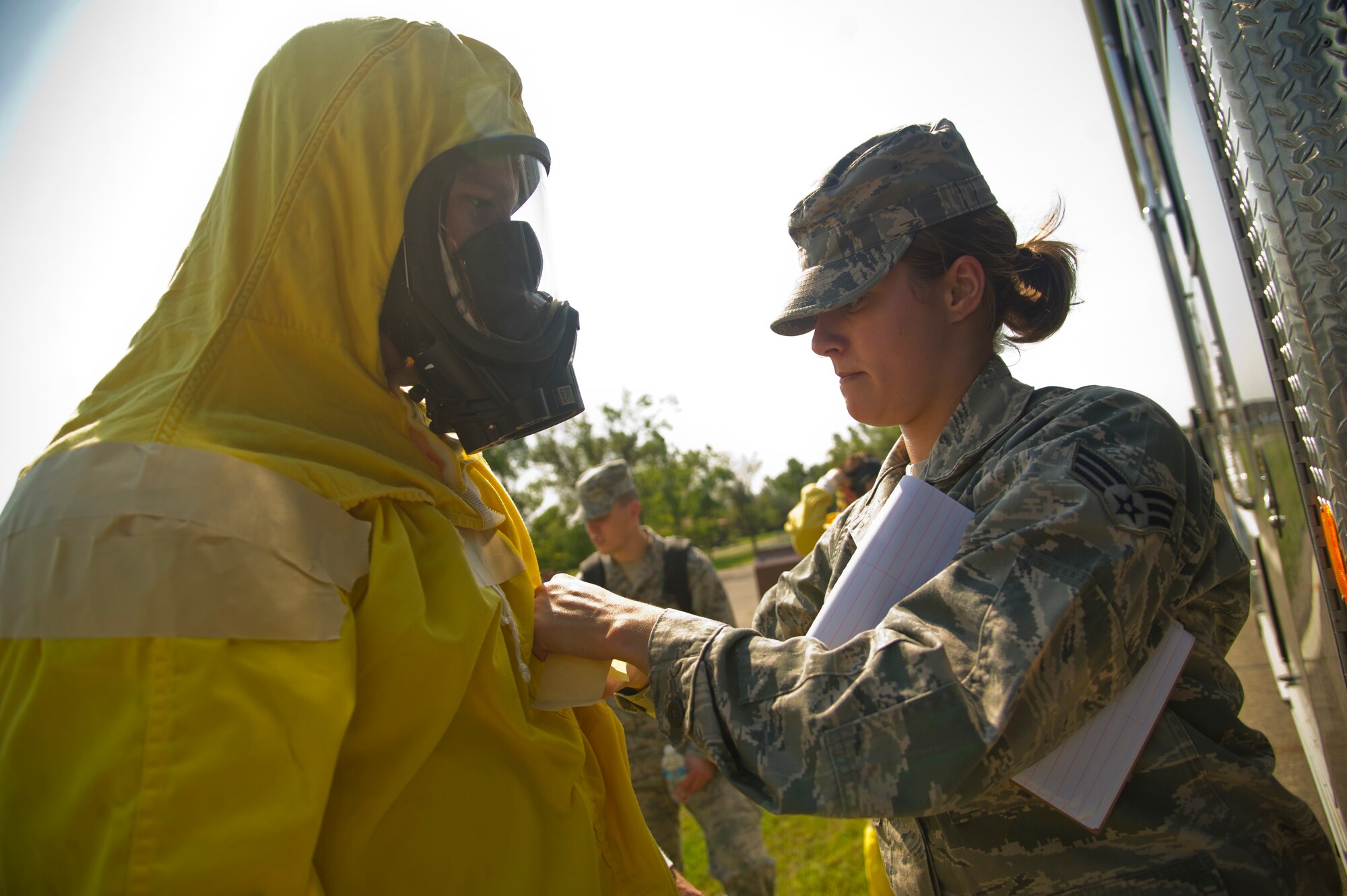 Explosive Ordnance Disposal technicians assigned to the 5th Civil Engineer Squadron arrive at the scene of an incident during a field training exercise at Minot Air Force Base, N.D., Aug. 20, 2013. The purpose of the exercise was to evaluate and validate the integration and response of emergency management, security forces, fire department, medical and missile field operations to an incident. (U.S. Air Force photo/Senior Airman Brittany Y. Auld)