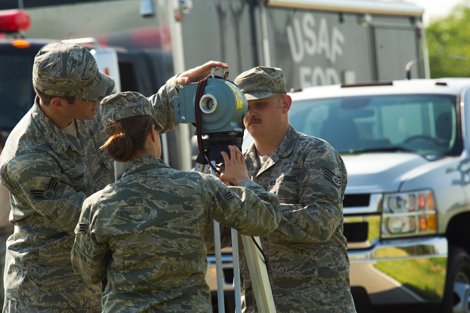 Bioenvironmental technicians assigned to the 5th Medical Support Squadron set up an air sampler during a field training exercise at Minot Air Force Base, N.D., Aug. 20, 2013. The air sampler is used to detect radioactive particles in the air. (U.S. Air Force photo/Senior Airman Brittany Y. Auld)