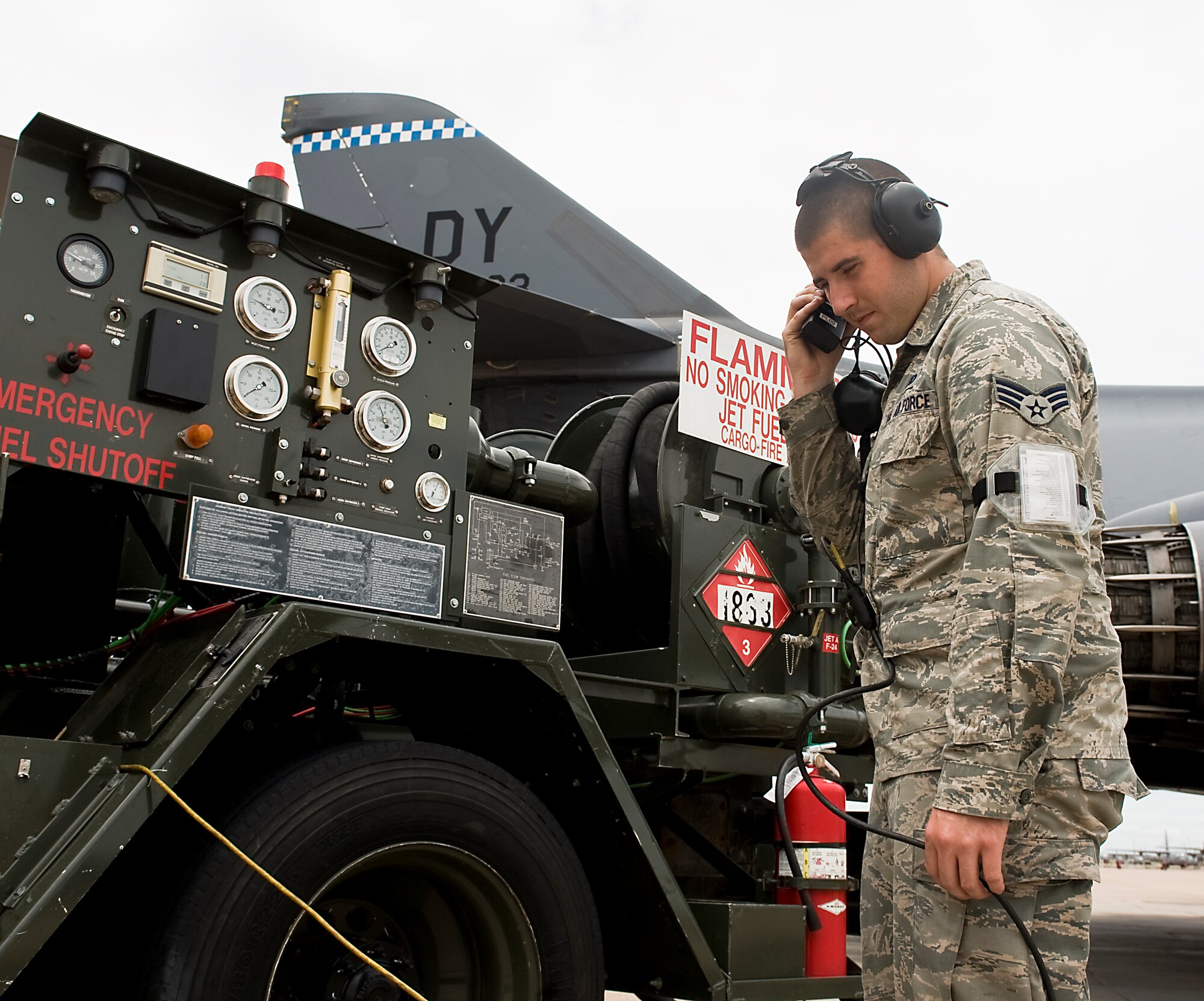 U.S. Air Force Senior Airman Lance Scarbrough, 7th Logistics Readiness Squadron, Petroleum, Oils and Lubricants flight, stands by an R-12 refueling truck during a hot-pit refuel Aug. 14, 2013, at Dyess Air Force Base, Texas. On July 19, Scarbrough used training he learned prior to joining the Air Force to provide self-aid buddy care to a civilian employee who had fallen from a maintenance stand. (U.S. Air Force photo by Airman 1st Class Peter Thompson/Released)