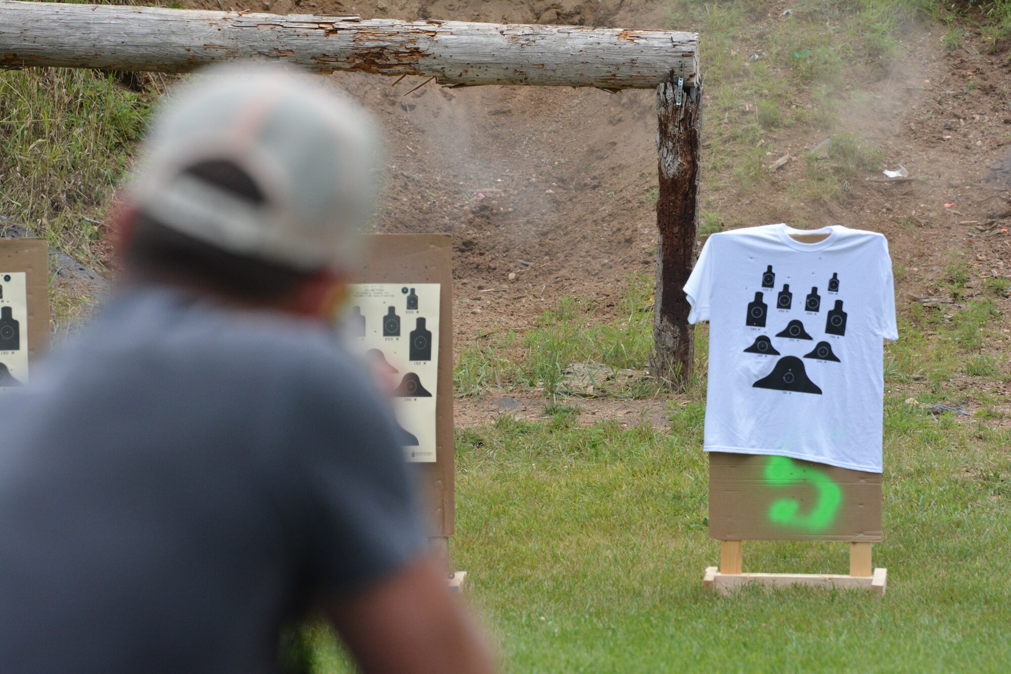 A rifle participant aims at his target during the 2nd Annual Explosive Ordnance Disposal Warrior 3-Gun Shoot at the Deerfield Rod and Gun Club in Deerfield, Wis., July 27, 2013. Attendees could buy t-shirts with smaller targets on them, for a chance to earn more points during the event. Money raised throughout the day was donated to the EOD Warrior Foundation, an organization that supports EOD warriors and their families, and maintains the EOD Memorial. (Air National Guard photo by Senior Airman Andrea F. Liechti)