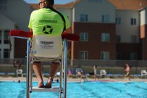 Ian Geigle, son of Senior Master Sgt. Douglas Geigle, 5th Logistics Readiness Squadron vehicle maintenance superintendant, keeps watch over swimming class participants during lessons at Minot Air Force Base, N.D., outdoor pool, Aug. 16, 2013Ian is a native of Anchorage Alaska and began working for Outdoor Recreation as a life guard in early June. (U.S. Air Force photo/Airman 1st Class Stephanie Sauberan)