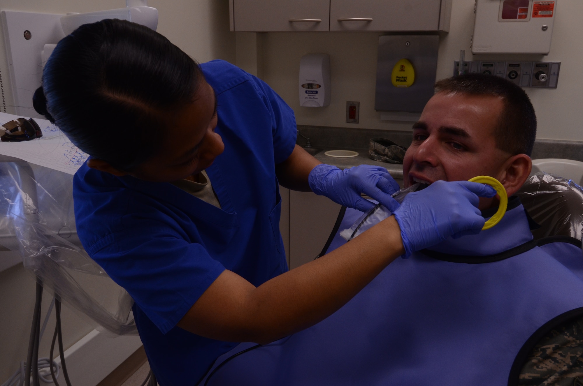 Master Sgt. Christina Denis, 36th Medical Operations Squadron Dental Flight chief, prepares a patient for an x-ray Aug. 15, 2013, on Andersen Air Force Base, Guam. Andersen’s dental clinic provides a full range of dental care to Tricare beneficiaries including cleanings, filling cavities and performing root canals. (U.S. Air Force photo by Airman 1st Class Emily A. Bradley/Released)