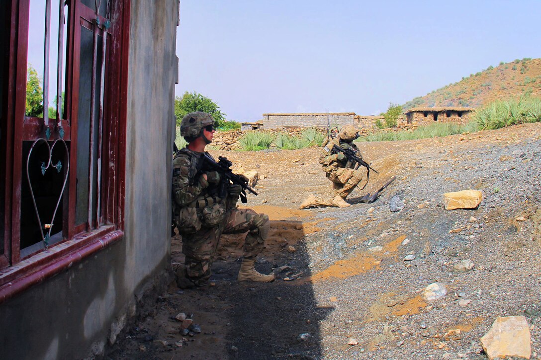 U.S. Army Sgts. Kenton D. Smith, right, and Justin A. Clymer pull security during a patrol to clear routes in Khowst province, Afghanistan, Aug. 14, 2013. Smith and Clymer, combat engineers, are assigned to the 101st Airborne Division's Company A, 4th Brigade Special Troops Battalion, 4th Brigade Combat Team.