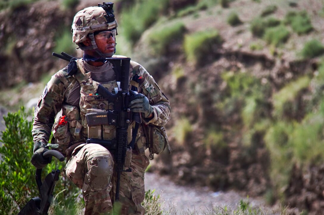 U.S. Army Sgt. Kenton D. Smith scans the area during a patrol to clear routes in Khowst province, Afghanistan, Aug. 14, 2013. Smith, a combat engineer, is assigned to the 101st Airborne Division's Company A, 4th Brigade Special Troops Battalion, 4th Brigade Combat Team.