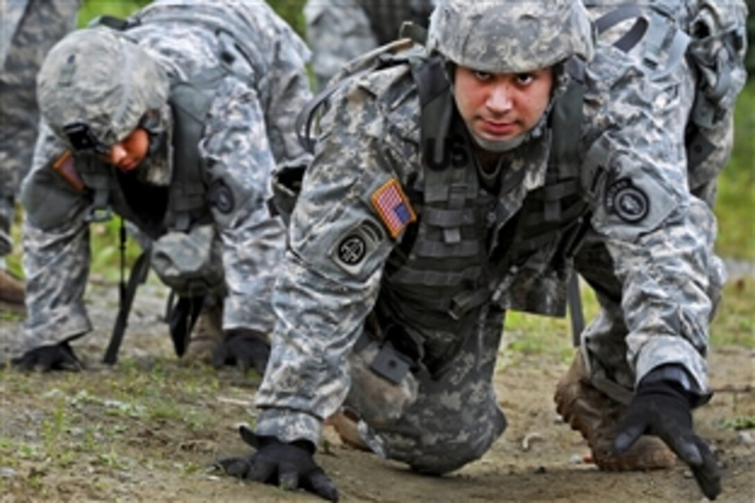 Army Sgt. Robert Blanco bear crawls up a hill during his unit's Best Soldier Competition on Joint Base Elmendorf-Richardson, Alaska, Aug. 14, 2013. Blanco is assigned to the 6th Engineer Battalion Combat, Airborne.