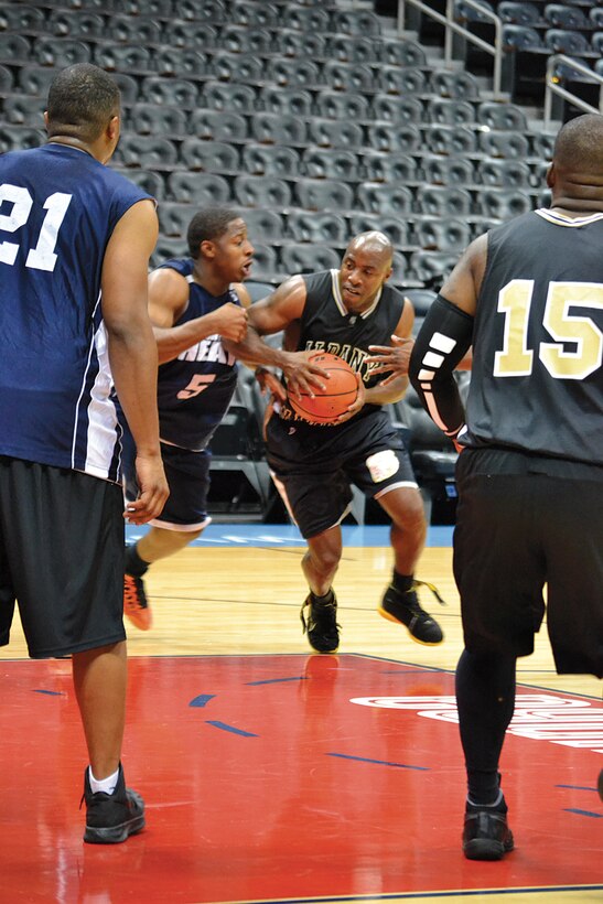 Marine Corps Logistics Base Albany team participates in the Atlanta Dream WomenÕs National Basketball Association Heroes Night basketball tournament, Aug. 11, at Phillips Arena in Atlanta, Ga.