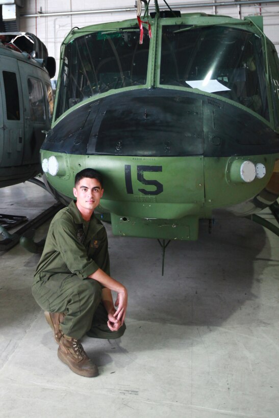 Cpl. David B. DeMartino stands next to a UH-1N Twin Huey at the Marine Light Attack Helicopter Squadron 467 hanger Friday. DeMartino, a San Jose, Calif. native, is a helicopter mechanic with the squadron. As a helicopter mechanic, DeMartino fixes discrepancies such as removing blades, gear boxes, engines, we work on flight controls and fuel cells on the aircraft.