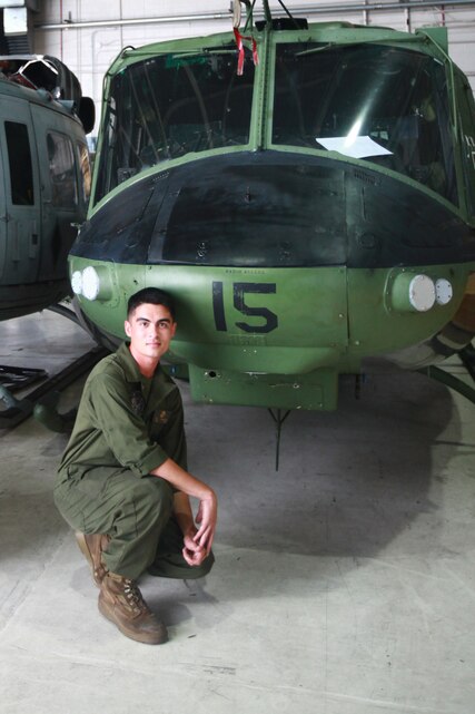 Cpl. David B. DeMartino stands next to a UH-1N Twin Huey at the Marine Light Attack Helicopter Squadron 467 hanger Friday. DeMartino, a San Jose, Calif. native, is a helicopter mechanic with the squadron. As a helicopter mechanic, DeMartino fixes discrepancies such as removing blades, gear boxes, engines, we work on flight controls and fuel cells on the aircraft.