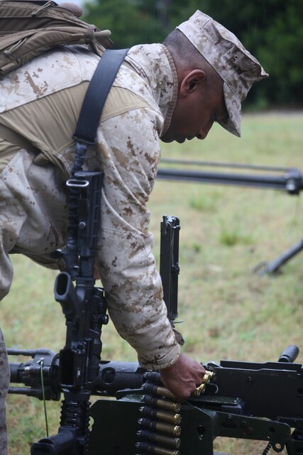 Master Sgt. Naim Mohammed loads an M2 .50-caliber heavy machine gun Aug. 15. MWSS-271 conducted water purification and distribution, electricity generation, road and culvert construction, airfield repair, forward arming and refueling point operations and convoy operations during the exercise. Mohammed is the motor transportation maintenance chief with MWSS-271.