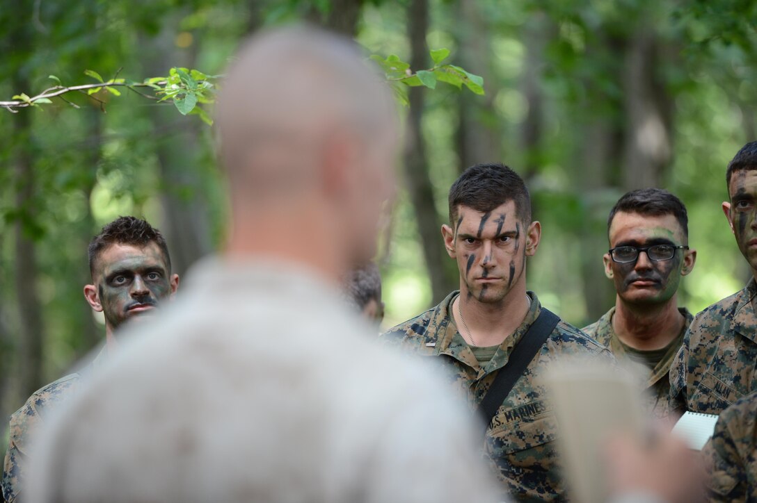 2nd Lt. Jacob Brown, 3rd squad leader for 3rd platoon, Charlie Co., The Basic School, listens intently to an advisor during Field Exercise II on Aug. 15, 2013. FEX II marks Charlie Co.’s midpoint in their training cycle.