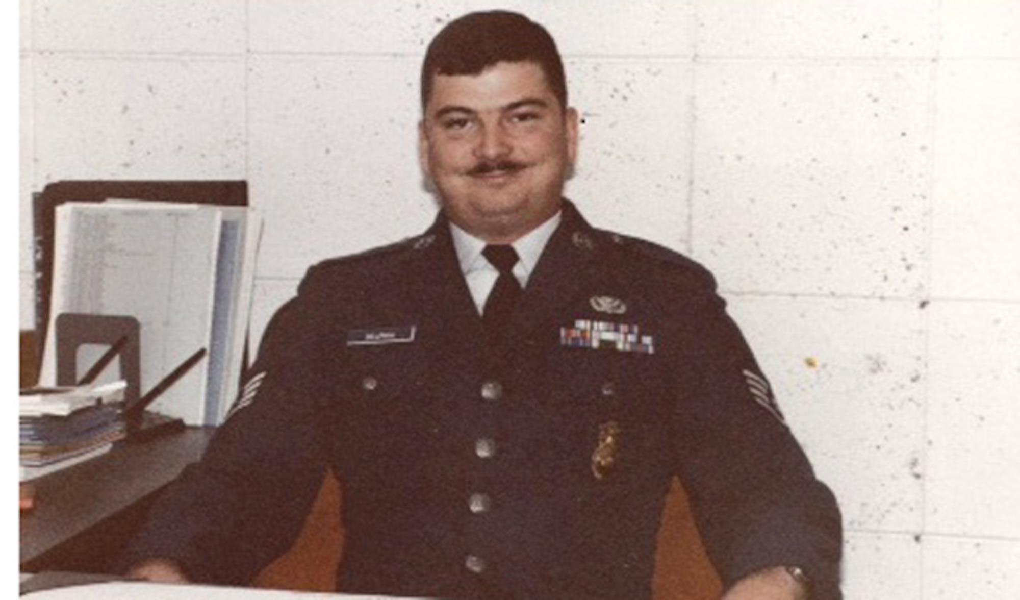 Staff Sgt. Bruce Delphia smiles for the camera as a member of the Air Force security forces in 1983 at Torrejon Air Base, Spain. His son, Staff Sgt. William Delphia, a 633rd Security Forces Squadron combat arms training and maintenance instructor, decided to enlist in the same career field as his father Bruce, continuing a heritage of security policemen. (Courtesy photo)