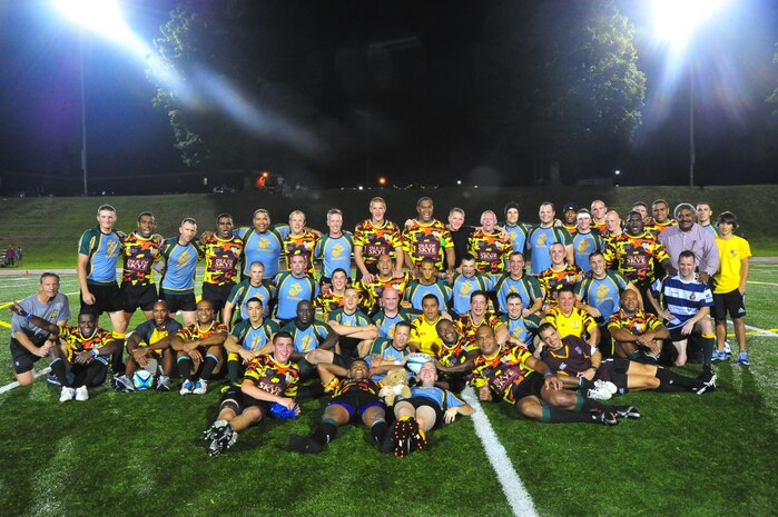 Members of the 1st Battalion Royal Regiment of Scotland Rugby Team and the Quantico Hooligans Rugby Football Club pose for a group photo after the first pre-season game of the season at Butler Stadium aboard Marine Corps Base Quantico on Aug. 22, 2013. The Scottish Team played their first of four games, in the Untied States, on the base before continuing on to Annapolis, N.Y. and Boston.