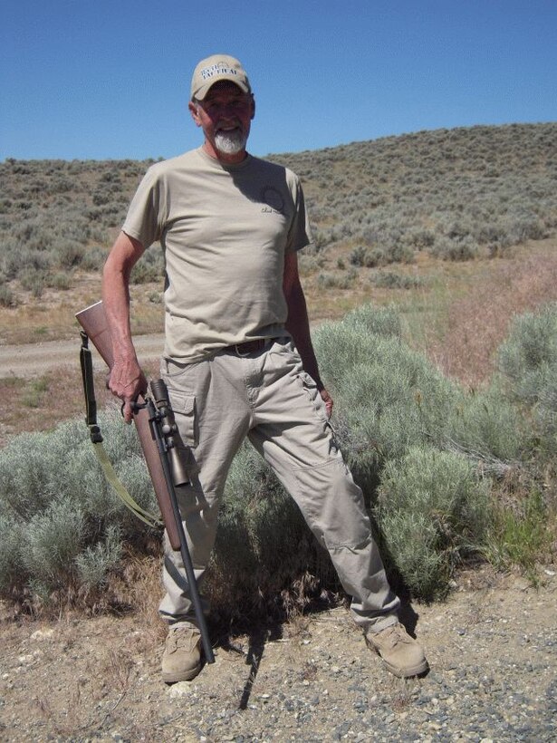 Chuck Mawhinney posing with a M40 rifle replica, the same type
of rifle he used in Vietnam.