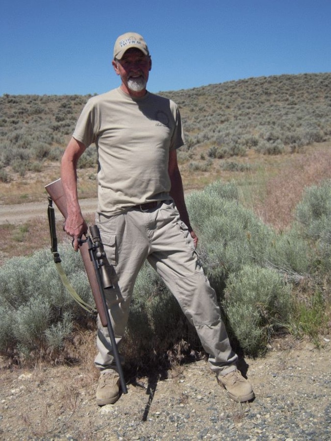 Chuck Mawhinney posing with a M40 rifle replica, the same type
of rifle he used in Vietnam.
