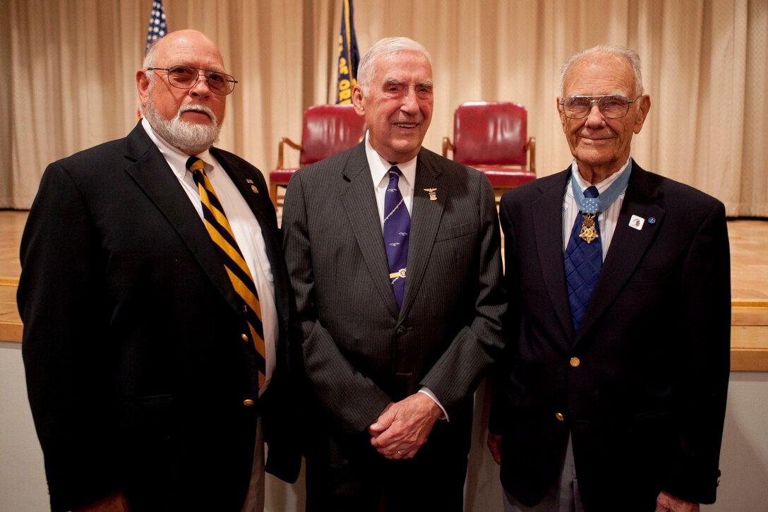 Ernest C. Brace stands with Theodore C. Lyster, mutual friend of Robert Maxwell, an Army Medal of Honor recipient, prior to his Purple Heart and Prisoner-of-War Medal award ceremony at Kingsley Air Force Base, Aug. 16, 2013. Maxwell, the only living Medal of Honor recipient in Oregon, attended the ceremony because he was invited by Lyster to celebrate Brace’s heroism. 