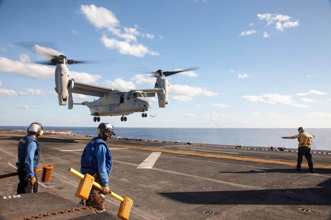 An MV-22 Osprey with Marine Medium Tiltrotor Squadron 265 (Reinforced), 31st Marine Expeditionary Unit, returns to the ship after carrying Marines of Company E., Battalion Landing Team 2nd Battalion, 4th Marines, 31st MEU, during a drill to mobilize a company-sized reaction force here, Aug. 22. To remain ready to reinforce any of the myriad contingencies the 31st MEU could face in the Asia-Pacific region, the unit trains to deploy reaction forces ranging in size from a squad to a company. The 31st MEU is the Marine Corps’ force in readiness for the Asia-Pacific region and the only continuously forward-deployed MEU. 