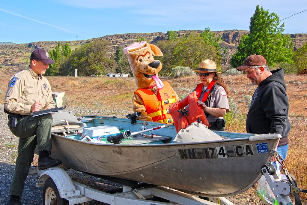 If you were visiting The Dalles in late April of 2013, you might have seen Bobber the Water Safety Dog while on his road trip with park ranger Amber Tilton, Kelly Thomas and David Ladouceur from The Dalles Lock and Dam.  

The day-long tour included a stop at Columbia Hills State Park to promote water safety in the Gorge and perform free boater safety checks in partnership with rangers from Washington State Parks and Washington Department of Fish and Wildlife. They also visited Spearfish Lake and met with families who were there for the lakes’ opening fishing celebration … those casting for trout received bobbers, and kids were given coloring books to help remind them to stay afloat by wearing a properly-fitted life jacket.  

Bobber the Water Safety Dog and his entourage ended their water safety adventures at the annual Cherry Fest where Bobber fitted life jackets and demonstrated how to be a “Smart Thinker – Not a Sinker” by wearing a life jacket.