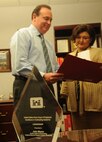 John Mayes, chief of the Directorate of Contracting at the U.S. Army Engineering and Support Center, and Lorronica Hamil, Business Management Specialist Huntsville, review a contract. Mayes received the National Contracting Organization’s Leadership Award at the U.S. Army Corps of Engineers’ Summer Leaders Conference Aug. 5 at Fort Belvoir, Va.