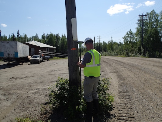 Tatton Suter, plan formulator in the Alaska District Civil Works Branch, records high water marks that occurred May 29 using a GPS rover system. This phase of the project was coordinated through the Alaska District Floodplain Management Program at the request of the state. High water marks were used by the Corps for a baseline structure elevation study. 