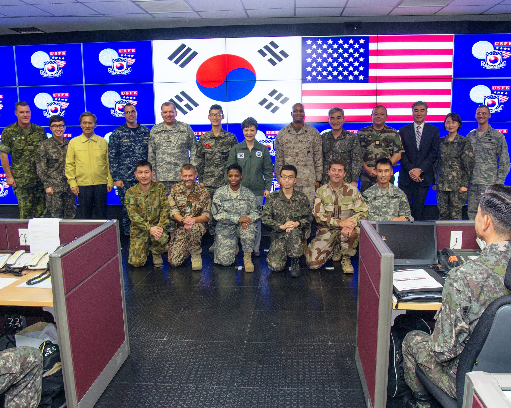 SEOUL, South Korea - Republic of Korea President Park Geun-Hye (second row, center) meets with U.S., ROK and United Nations Sending States service members during a visit to CP TANGO Aug. 22.  Gen. James Thurman, commander, United Nations Command, Combined Forces Command and U.S. Forces Korea, briefed President Park on Ulchi Freedom Guardian, an annual computer-simulation command post exercise led by the ROK – US Combined Forces Command. UFG is designed to ensure readiness to defend the Republic of Korea and sustain the capabilities that strengthen the ROK-U.S. Alliance. Nearly 30,000 U.S. service members stationed in Korea, along with approximately 3,000 coming from off-peninsula, are participating in the exercise with military, civil and government personnel from the Republic of Korea, and personnel from the United Nations Command Sending States of Australia, Canada, Denmark, France, Netherlands, New Zealand, Norway and the United Kingdom. (Photo by Sgt. Brian Gibbons, USFK/PAO)