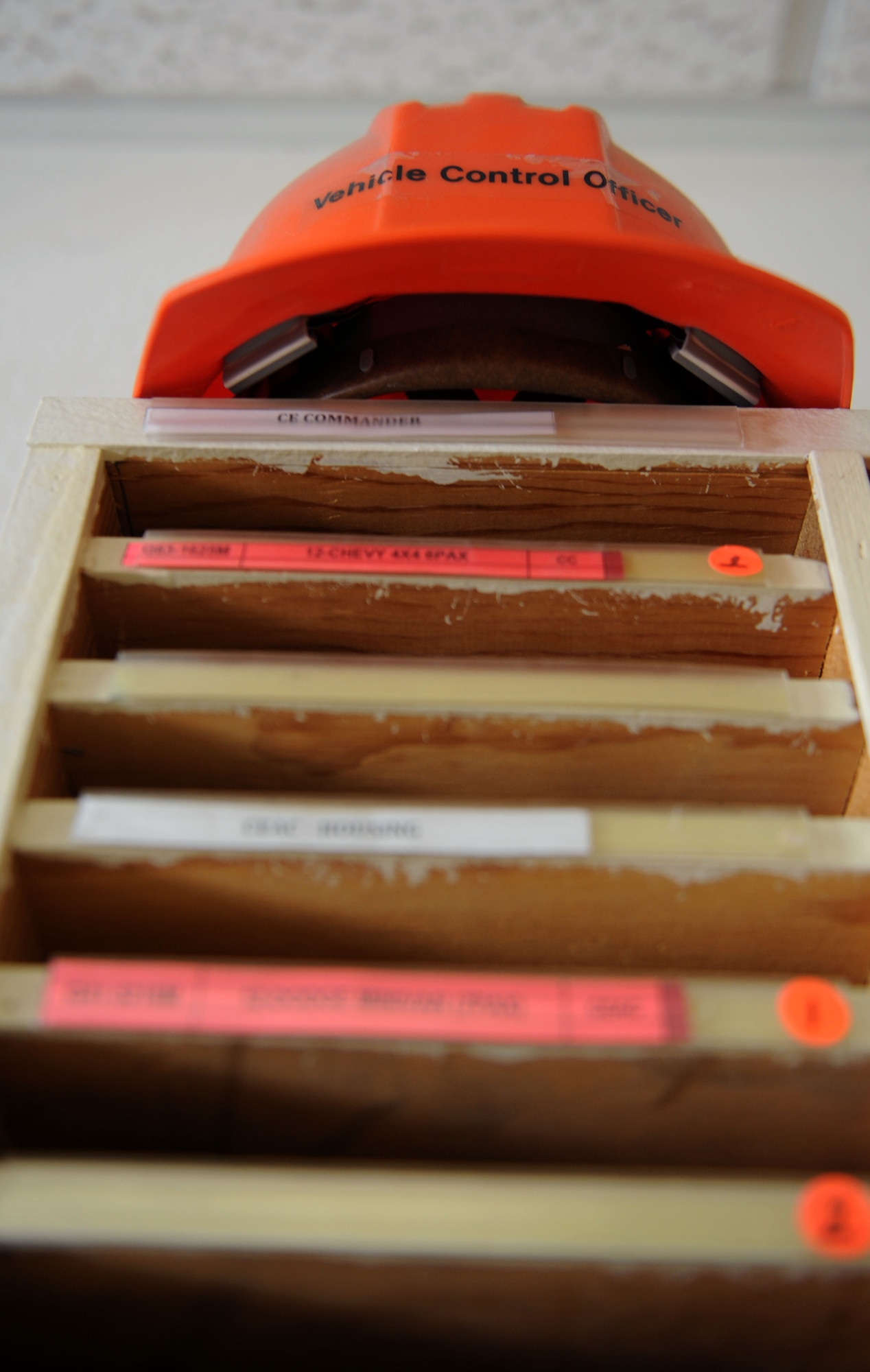 A hardhat sits atop a filing system for 355th Civil Engineer Squadron fleet vehicle records at Davis-Monthan Air Force Base, Ariz., Aug. 20, 2013. The labeled cubby holes hold paperwork such as service requests for work vehicles. (U.S. Air Force photo by Airman 1st Class Saphfire Cook/Released)