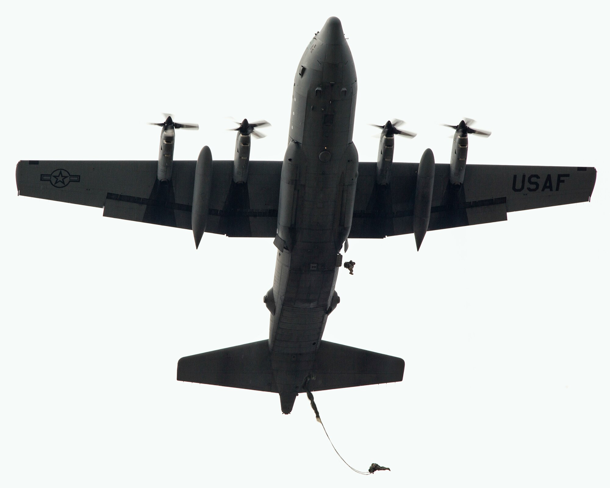 YOKOTA AIR BASE, Japan -- U.S. Army soldiers assigned to 1st Battalion, 1st Special Forces Group, jump from a C-130 Hercules during joint jump training with aircrews from the 36th Airlift Squadron at Yokota Air Base, Japan, Aug. 21, 2013. The training not only allowed the soldiers to practice jumping, but it also allowed the Yokota aircrews to practice flight tactics and timed package drops. (U.S. Air Force photo by Osakabe Yasuo)