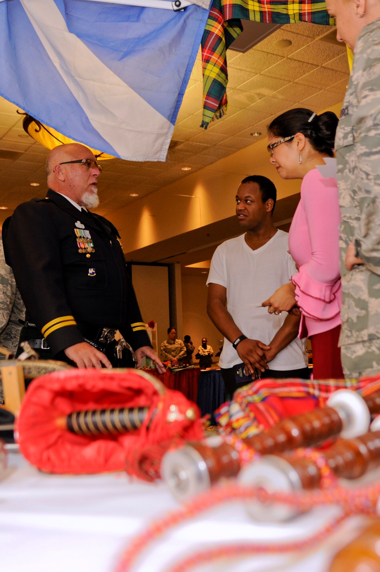 VANDENBERG AIR FORCE BASE, Calif. – Rickie Gable, 30th Space Wing anti-terrorism director, speaks about the Scottish culture at the Scotland booth during this year’s annual Cultural Diversity Day at the Pacific Coast Club here Wednesday, Aug. 21, 2013. Vandenberg’s Diversity Day combined all annual cultural observances into one gala event of food, music, dance and displays. (U.S. Air Force photo/Senior Airman Lael Huss)