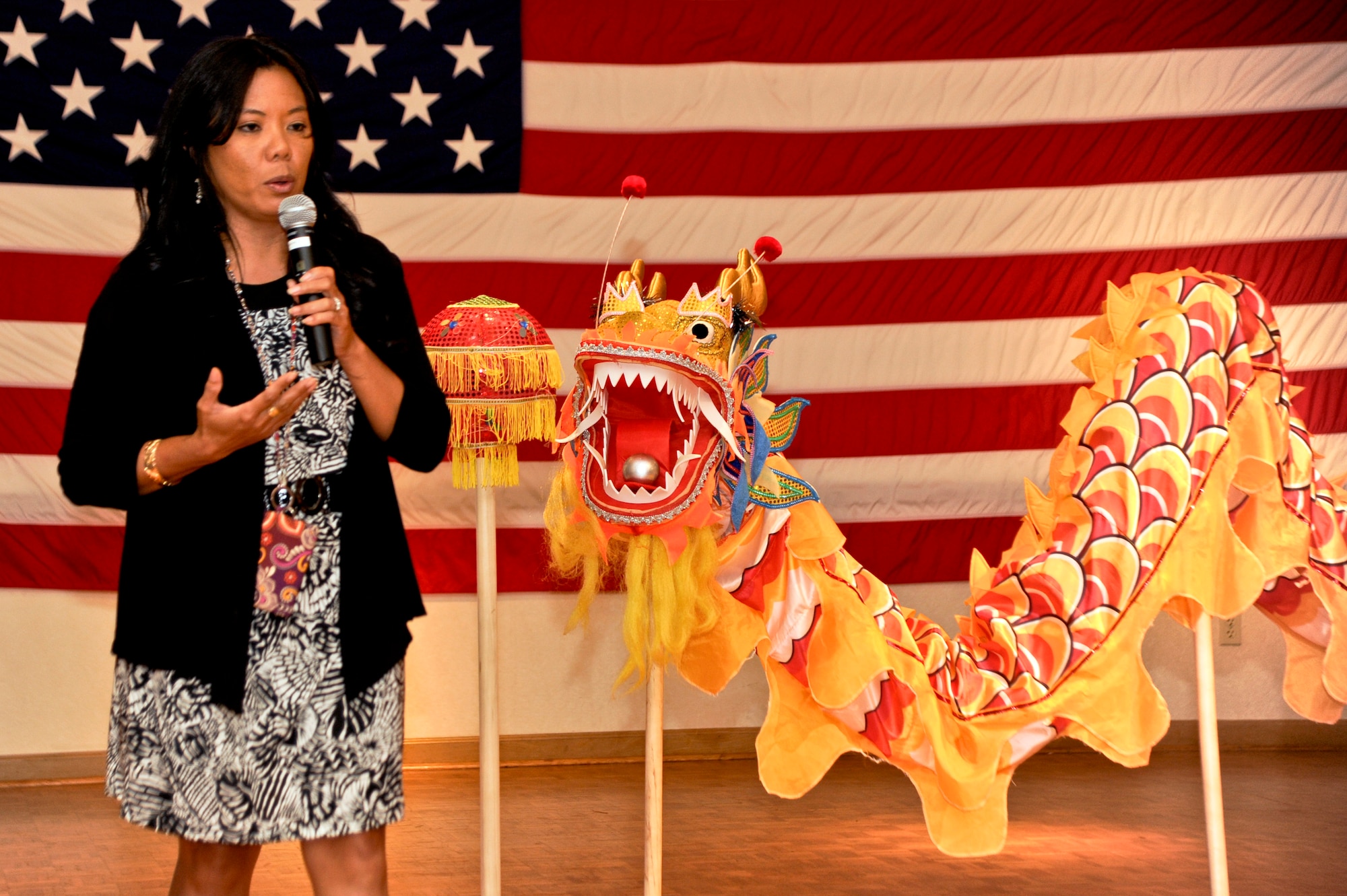 VANDENBERG AIR FORCE BASE, Calif. – Pauline Chui, 30th Space Wing Outreach Program manager, speaks about the Chinese New Year during this year’s annual Cultural Diversity Day at the Pacific Coast Club here Wednesday, Aug. 21, 2013. Diversity Day is the culmination of all the Department of Defense recognized monthly observances into one event. (U.S. Air Force photo/Senior Airman Lael Huss)