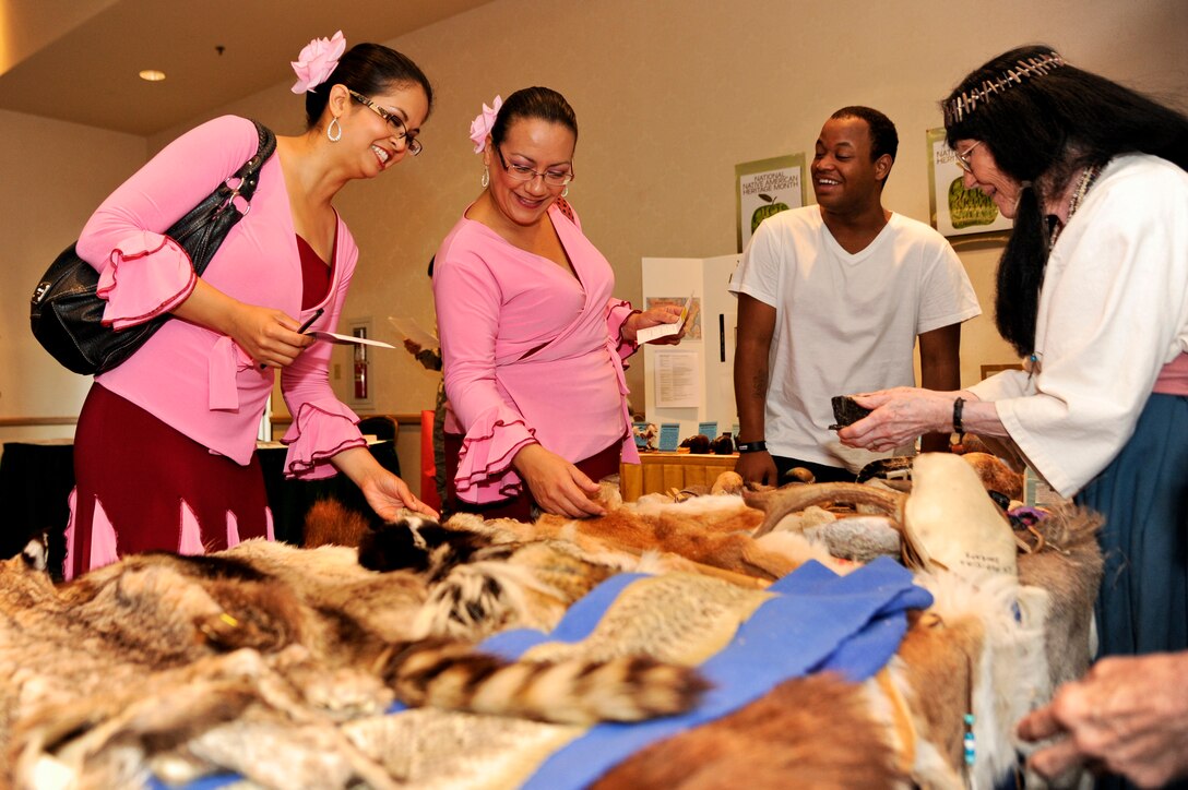 VANDENBERG AIR FORCE BASE, Calif. – Debbie Beal, Just Dance Lompoc assistant manager and instructor, and two other JDL instructors view the animal pelts displayed on the La Purisima Mission State Historic Park booth during this year’s Diversity Day at the Pacific Coast Club here Wednesday, Aug. 21, 2013. Vandenberg’s Diversity Day combined all annual cultural observances into one gala event of food, music, dance and displays. (U.S. Air Force photo/Senior Airman Lael Huss)